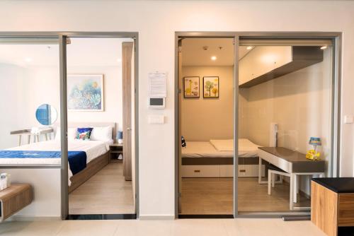 Postel nebo postele na pokoji v ubytování The Sóng Condotel in Vung Tau City - The Sóng Real Company