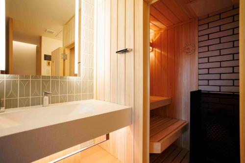 a bathroom with a sink and a mirror at Gion Elite Terrace in Kyoto