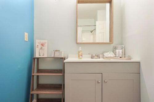 a bathroom with a sink and a mirror at Beautiful Blue Ocean Condo in Myrtle Beach