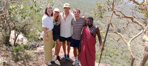 a group of people standing on top of a mountain at Maasai homestay camping in Sekenani