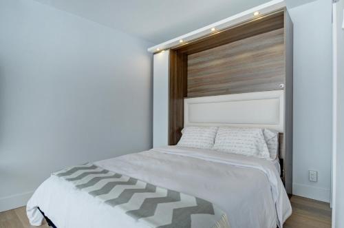 En eller flere senge i et værelse på Les Immeubles Charlevoix - Le 760306