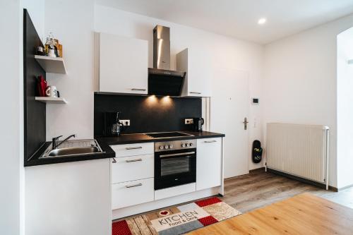 Una cocina o zona de cocina en Gemütliche Wohnung im Zentrum Top 2