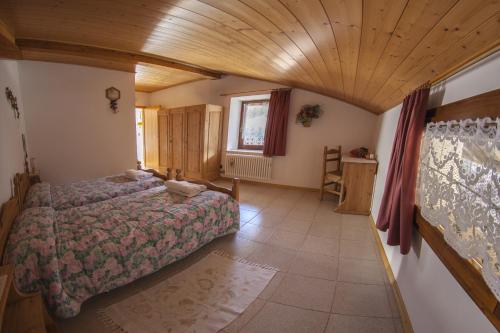 Ένα ή περισσότερα κρεβάτια σε δωμάτιο στο B&B Casa Zeni