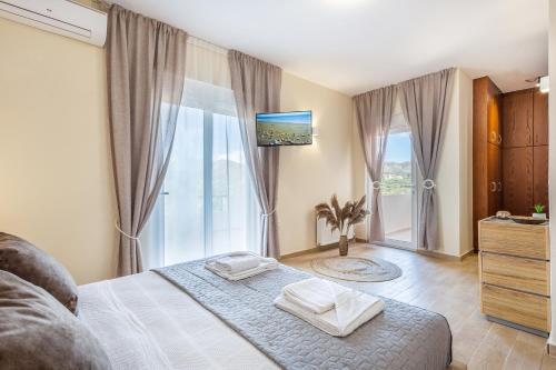 Ένα ή περισσότερα κρεβάτια σε δωμάτιο στο Villa Thamyris