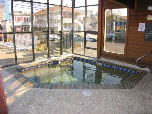 a small swimming pool in the middle of a building at Beau Rivage Motel in Old Orchard Beach