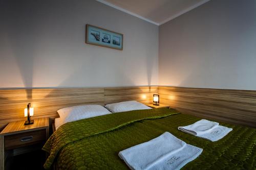 Una cama o camas en una habitación de Hotel Alpex