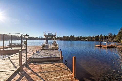 a dock with a cage on the water at Stunning Kent Lake House with Private Dock! in Kent