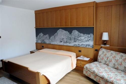 Postel nebo postele na pokoji v ubytování Hotel Garni Soreie