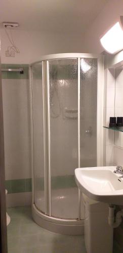 a bathroom with a shower and a sink at Chrysalis Bay in Porto Cervo
