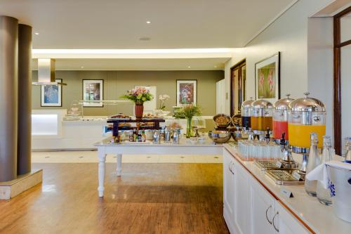 a large room with a laboratory with many bottles on a counter at Protea Hotel by Marriott George King George in George