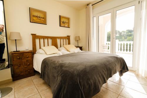 Giường trong phòng chung tại Villa Sol y Mar