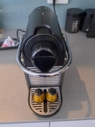 a pair of shoes sitting in a holder on a desk at Backup-Powered Colourfull City Balcony Apartment in Cape Town