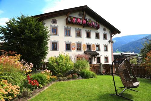 a house with a tennis racket in the yard at Apartment Edith in Telfes im Stubai