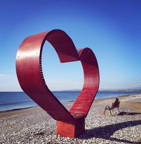 a sculpture of a heart on the beach at Stunning 1-Bed Apartment in Larnaca near the sea in Pervolia