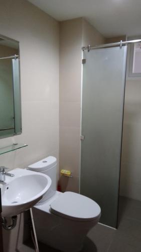 a bathroom with a toilet and a sink and a shower at AnE House 1 - Spacious 2BR Apartment 69m2 - SHP Plaza - Hai Phong City Center in Hai Phong