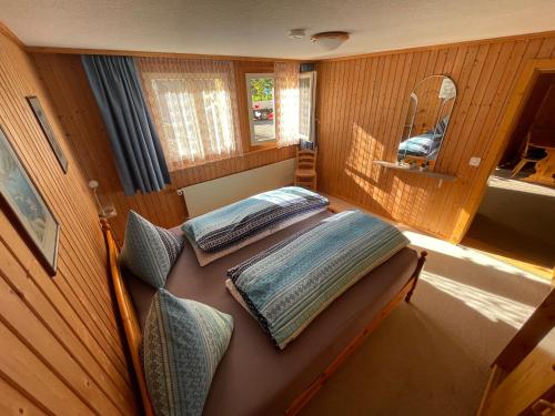 a small room with two beds in a boat at Eigerhome - Chalet am Bühl in Grindelwald