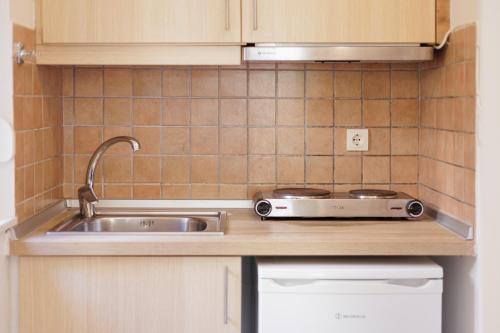 Kjøkken eller kjøkkenkrok på Aloe Apartments