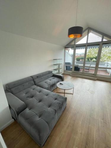 a living room with a couch and a table at Air Apartments 9 in Bremen