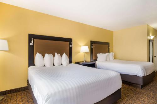 a hotel room with two beds and two lamps at Best Western Escondido Hotel in Escondido