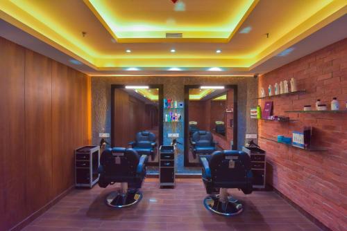a barber shop with a row of barber chairs at Ratnamouli Palace in Guwahati
