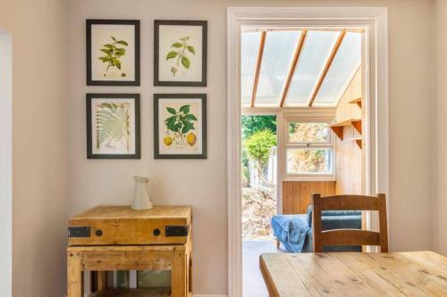 a dining room with a table and a window at Broadstairs Family Home in Kent