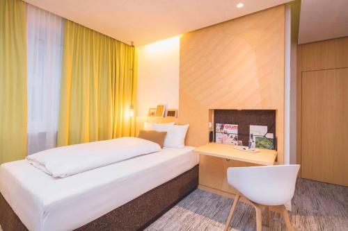 Postel nebo postele na pokoji v ubytování Hotel Luise