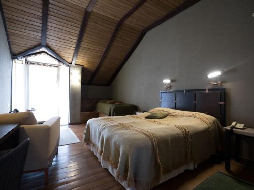 Postel nebo postele na pokoji v ubytování Tufenkian Avan Marak Tsapatagh Hotel