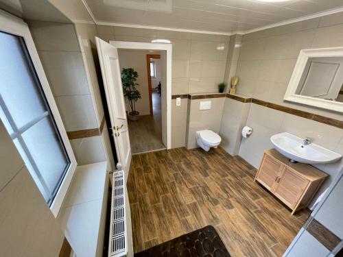 a bathroom with a sink and a toilet at Ferienwohnung Melise in Reutte