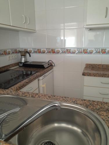 a kitchen with a sink and a counter top at Estudio La Corbeta in Torrox Costa