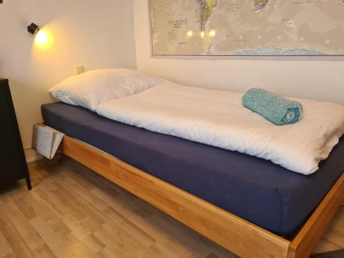 a bed in a room with a blue mattress at Lichtdurchflutetes Zimmer - Marienberg in Waldbüttelbrunn