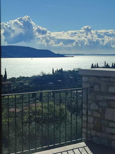 a view of a body of water from a balcony at Agriturismo L'Uliveto in Gargnano