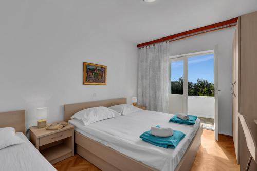 Postel nebo postele na pokoji v ubytování Apartment Marica