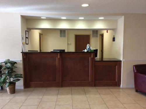 a waiting room with a reception desk in a hospital at Days Inn by Wyndham Greensboro NC in Greensboro