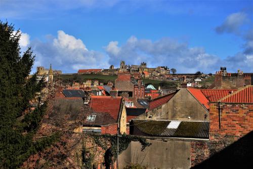 a view of a city with buildings and roofs at Abbey View Bagdale in the Centre of Whitby in Whitby