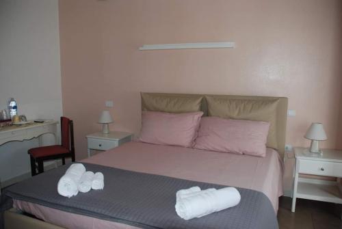 Un ou plusieurs lits dans un hébergement de l'établissement B-KARALIS DI ENRICO TUPPUTI