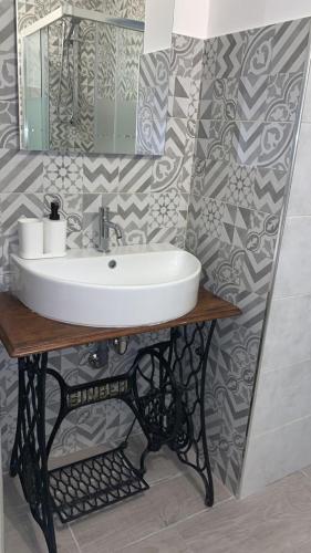 a bathroom with a sink and a mirror at Catania Centro Storico in Catania