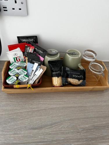 a tray with food and other items on a table at Lucerne B&B in Lyme Regis