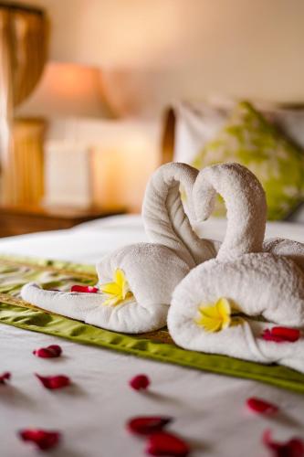 Letto o letti in una camera di Three Brothers Bungalows & Villas
