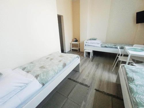 Ένα ή περισσότερα κρεβάτια σε δωμάτιο στο BOSiR Białogard
