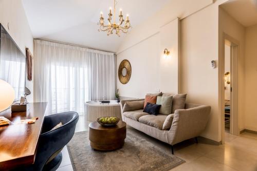 a living room with a couch and a table at Amirey Hagalil Boutique Hotel in Amirim