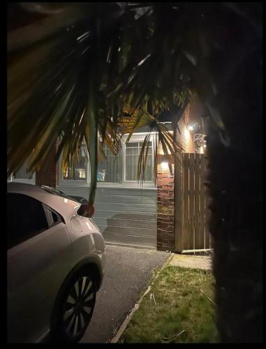 a car parked in front of a house at Man Studio - StereoShower FreeParking 5min-Metro in Manchester