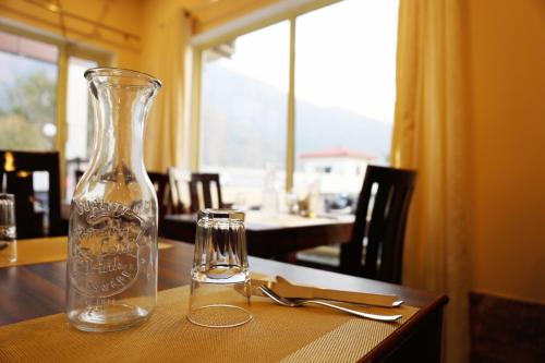 a glass vase sitting on top of a table at Tapovan New Residency By FTP Hotels in Rishīkesh