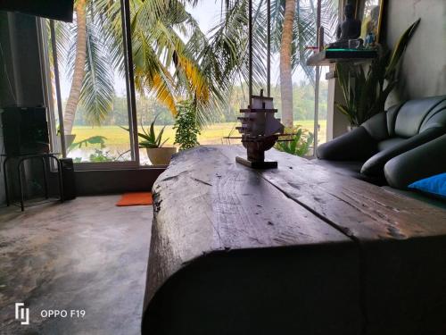 a living room with a table with a fire hydrant on it at Heena villa in Kamburugamuwa