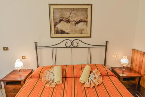 Ένα ή περισσότερα κρεβάτια σε δωμάτιο στο Agriturismo Podere Bellosguardo