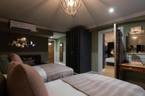 Katil atau katil-katil dalam bilik di Hort's Townhouse
