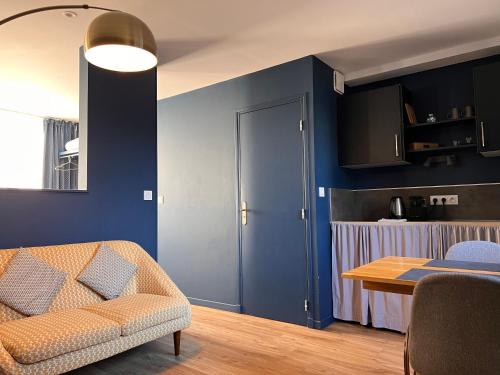 a living room with a couch and a table at PlacesAppart in Arras