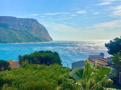 a view of the ocean and a mountain at Astoria Villa maison d hôtes Appartement vue mer avec piscine in Cassis