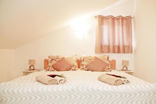 מיטה או מיטות בחדר ב-Apartments Du Lux