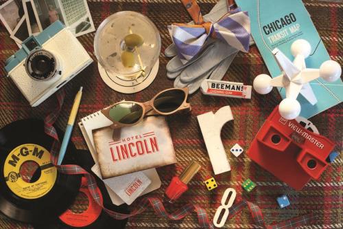 a pile of items on a blanket with a pair of glasses at Hotel Lincoln in Chicago