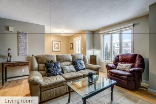 a living room with a couch and two chairs at Comfy Private Bedroom near Downtown Ottawa/Gatineau in Gatineau